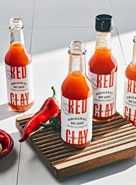 Red Clay Original Hot Sauce eggs topping video-ready drizzle for breakfast or brunch.