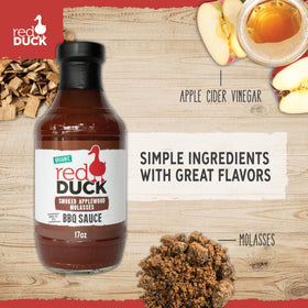 Red Duck Smoked Applewood Molasses BBQ Sauce being poured over chicken for glaze