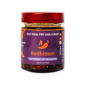 Redbloom Gut-Healthy Chili Crisp bottle on counter adds vibrant crunch to meals