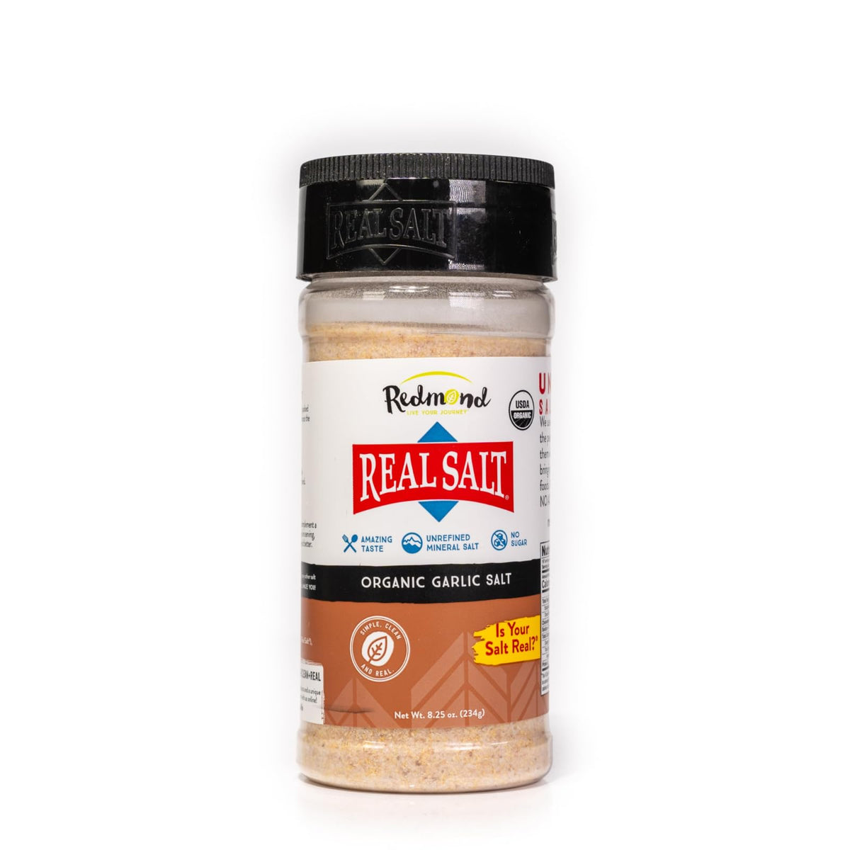 Redmond Real Salt Garlic Salt bottle pour highlights mineral-rich flavor for richer meals