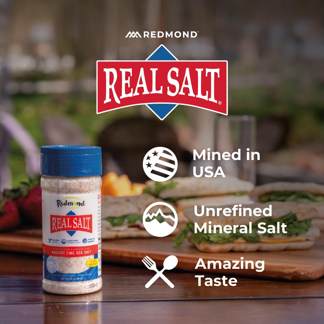 Two-pack Redmond Real Sea Salt shakers on kitchen counter.