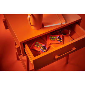 Cups stacked in pantry, perfect for lunchboxes and snacks.
