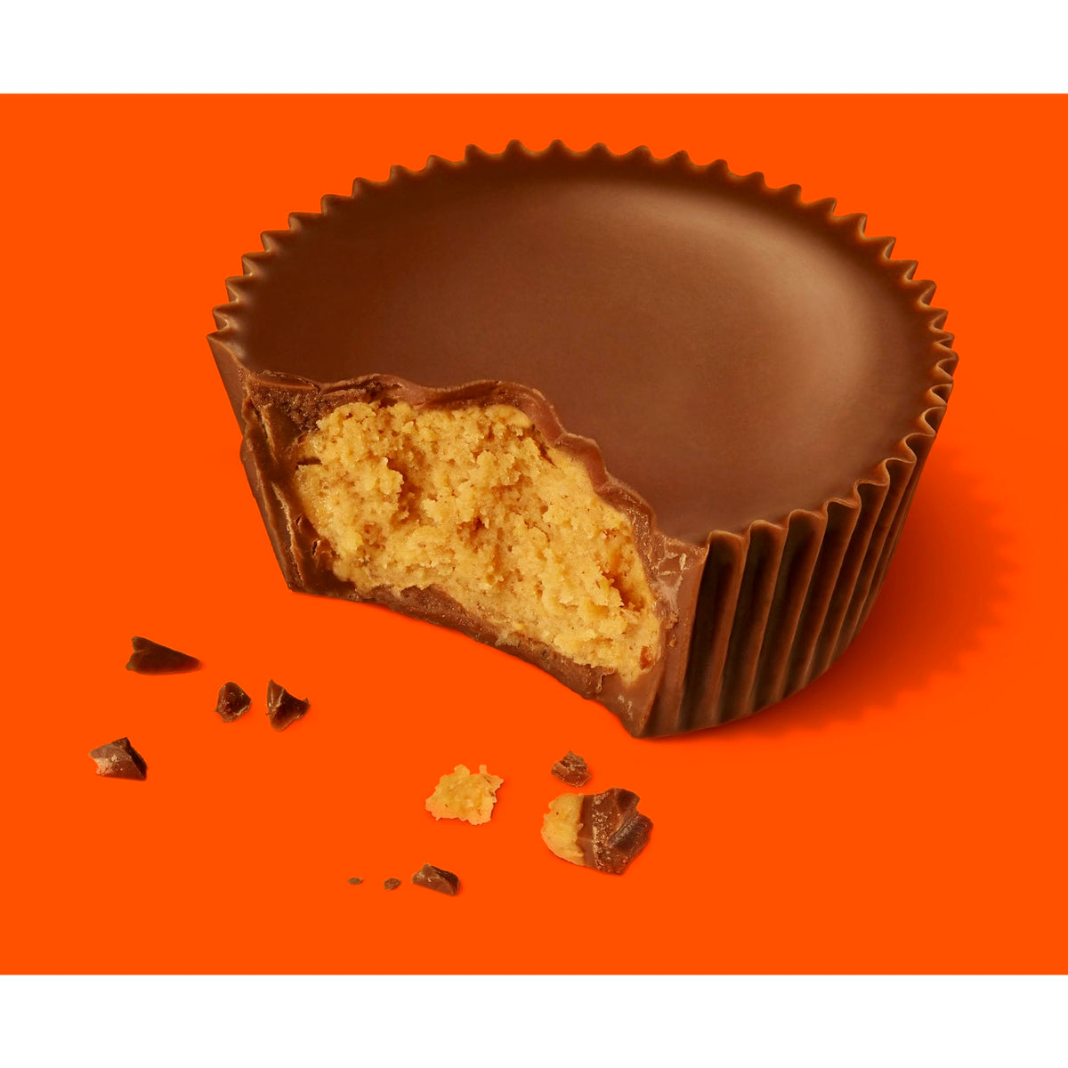 Reese's Peanut Butter Big Cup cross-section reveals chocolate shell and filling.