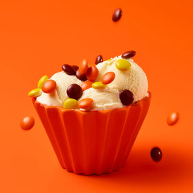 Reese's Pieces on a party tray attractively arranged for guests.