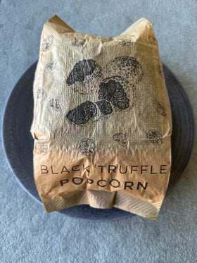 Regalis microwavable black truffle popcorn foil-sealed packaging preserves flavor.