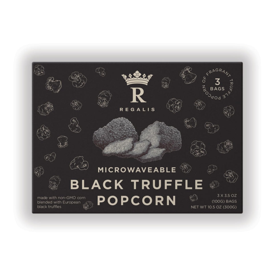 Regalis microwavable black truffle popcorn pack on shelf, premium gifting appeal.