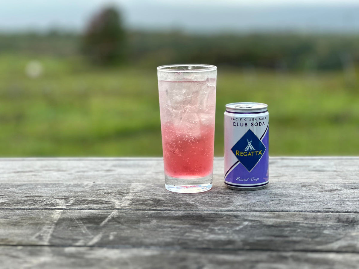 Regatta Pacific Sea Salt Club Soda being poured, enhancing a crisp, refreshing drink.