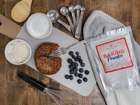 Relative Foods Baking Powder on the counter ready for fluffy cakes and muffins.