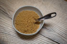 Relative Foods brown sugar crystals close-up, highlighting natural molasses richness.