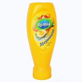 Remia mayonnaise bottle being squeezed; creamy texture ideal for burgers and dips.
