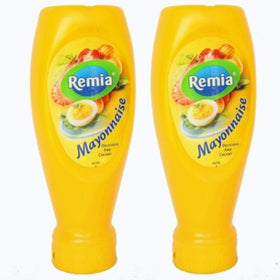 Remia mayonnaise two-pack bottles on kitchen counter for sandwiches and salads.