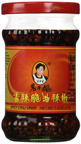 Ren Dao Mei Spicy Chili Crisp bottle pour enhances noodles and stir-fries