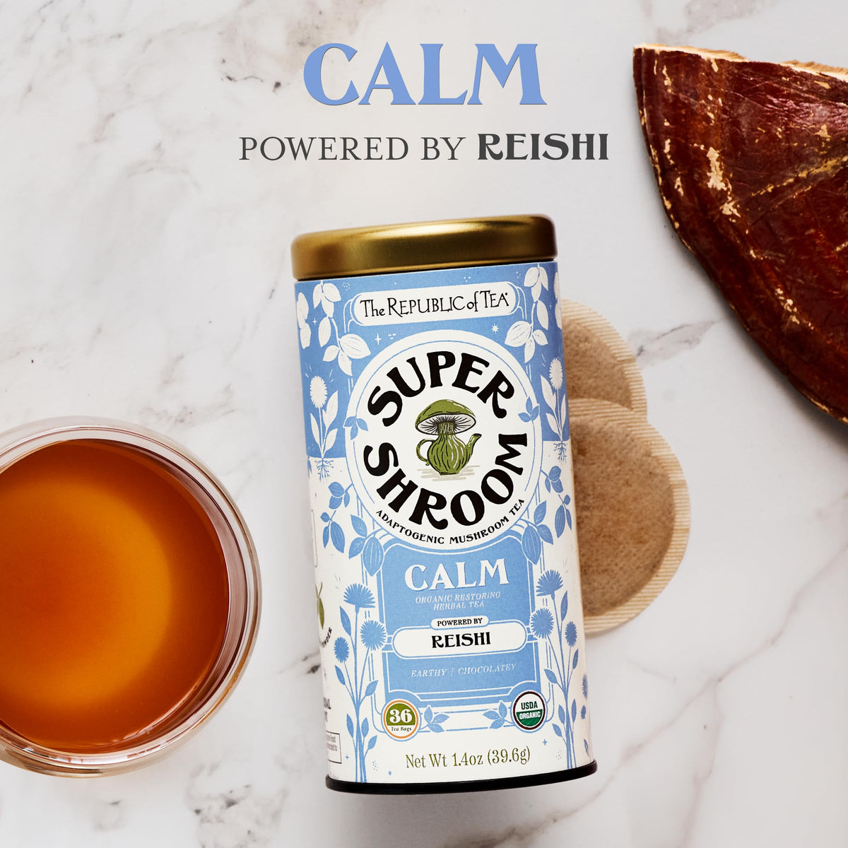 The Republic of Tea steeping SuperShroom Calm tea, a soothing ritual with rich cocoa notes.