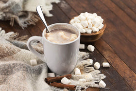 Hot cocoa topped with marshmallow bits for cozy sweetness