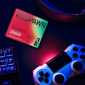 Ambient gaming desk scene with RESPAWN on the play-ready setup.