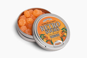 Retro Sours Tangerine tin showcasing bold tangy flavor for nostalgia-inspired snacking.