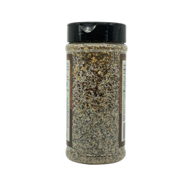 Burger-ready Revolution Barbecue rub adding savory depth.
