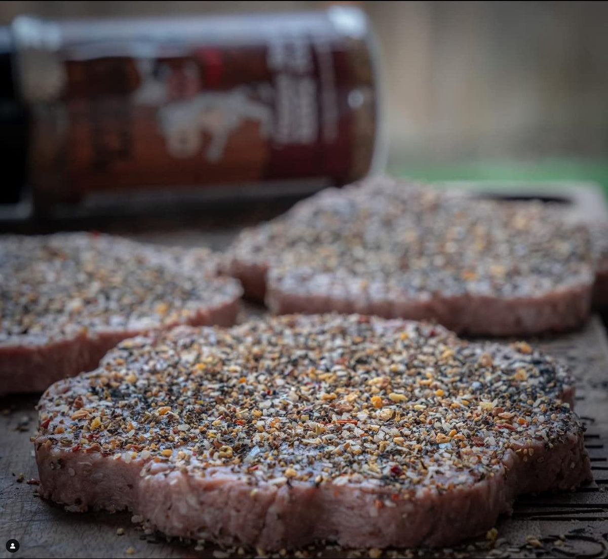 Colorado woman-owned brand Revolution Barbecue rub bottle on counter.