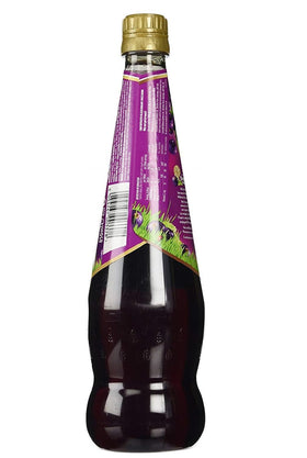 Ribena glass with dark purple drink ready to sip and share.