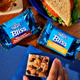 Rice Krispies Treats Bliss bar beside coffee, ideal afternoon snack.