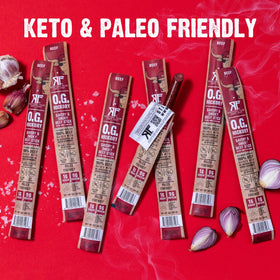Righteous Felon OG Hickory beef stick beside gym bag snack option