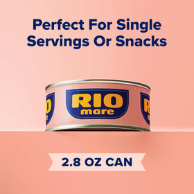 Golden olive oil pours around tuna signaling premium Italian ingredients.