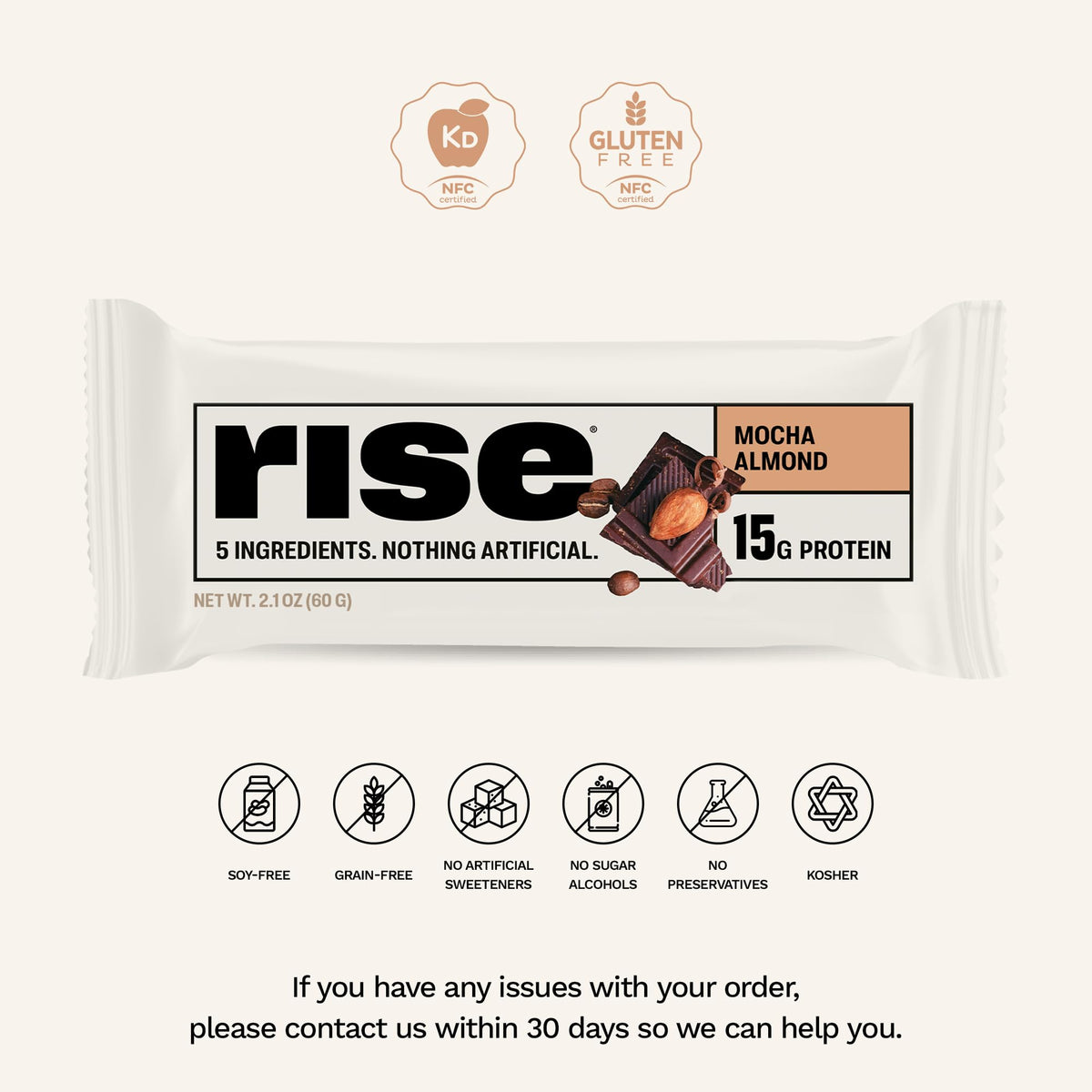 Slice of Rise Mocha Almond whey protein bar reveals creamy interior.