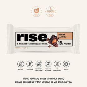 Slice of Rise Mocha Almond whey protein bar reveals creamy interior.