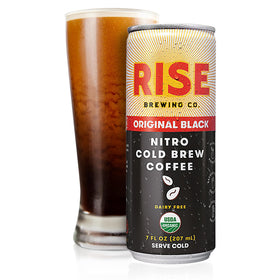 Pour of RISE Original Black Nitro Cold Brew into glass showing nitro texture.