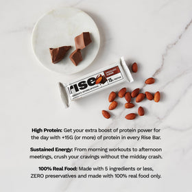 Cross-section reveals creamy center with almond crunch in Rise bar.