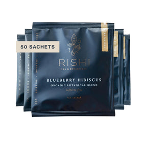 Rishi Tea Blueberry Hibiscus sachet in a mug for a bright, caffeine-free moment