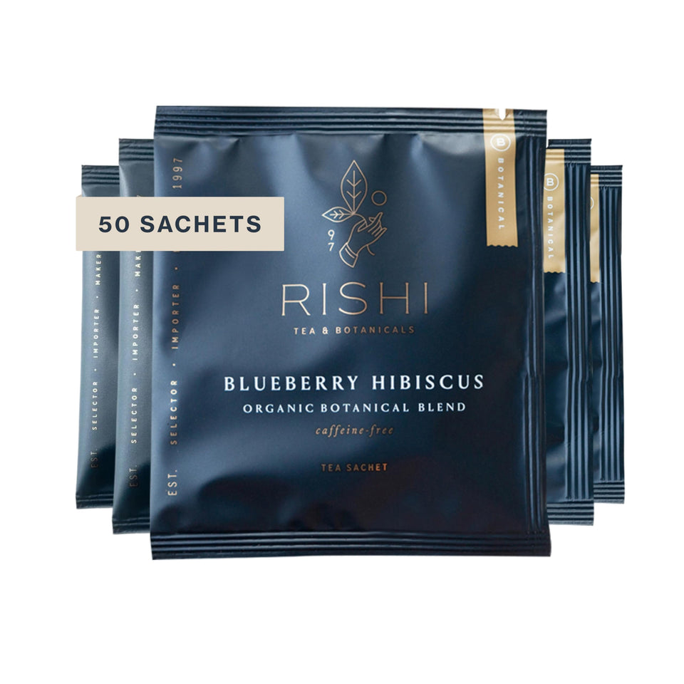 Rishi Tea Blueberry Hibiscus sachet in a mug for a bright, caffeine-free moment