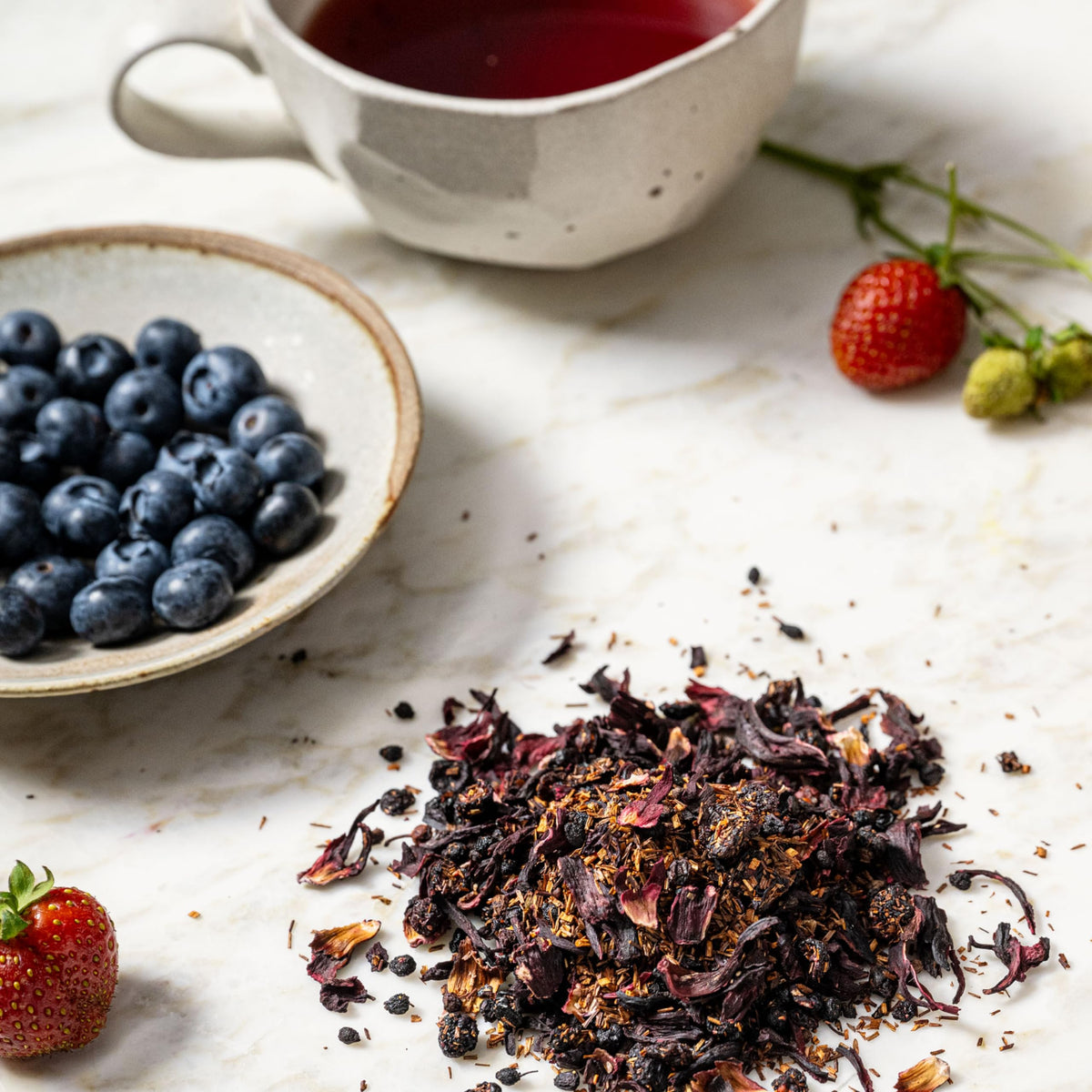 Rishi Tea Blueberry Rooibos iced glass, bright tart sweetness perfect for summer.