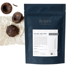 Rishi Tea Ancient Pu'er Tuo Cha cake on display, rich aroma hints at lasting flavor.