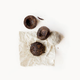 Rishi Tea Pu'er cup with aroma rising, bold yet balanced flavor.