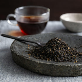 Rishi Tea brand label closeup reinforces organic quality and ethical sourcing.