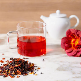 Rishi Tea Hibiscus Berry brand ethics symbol indicates organic, kosher, and non-GMO quality