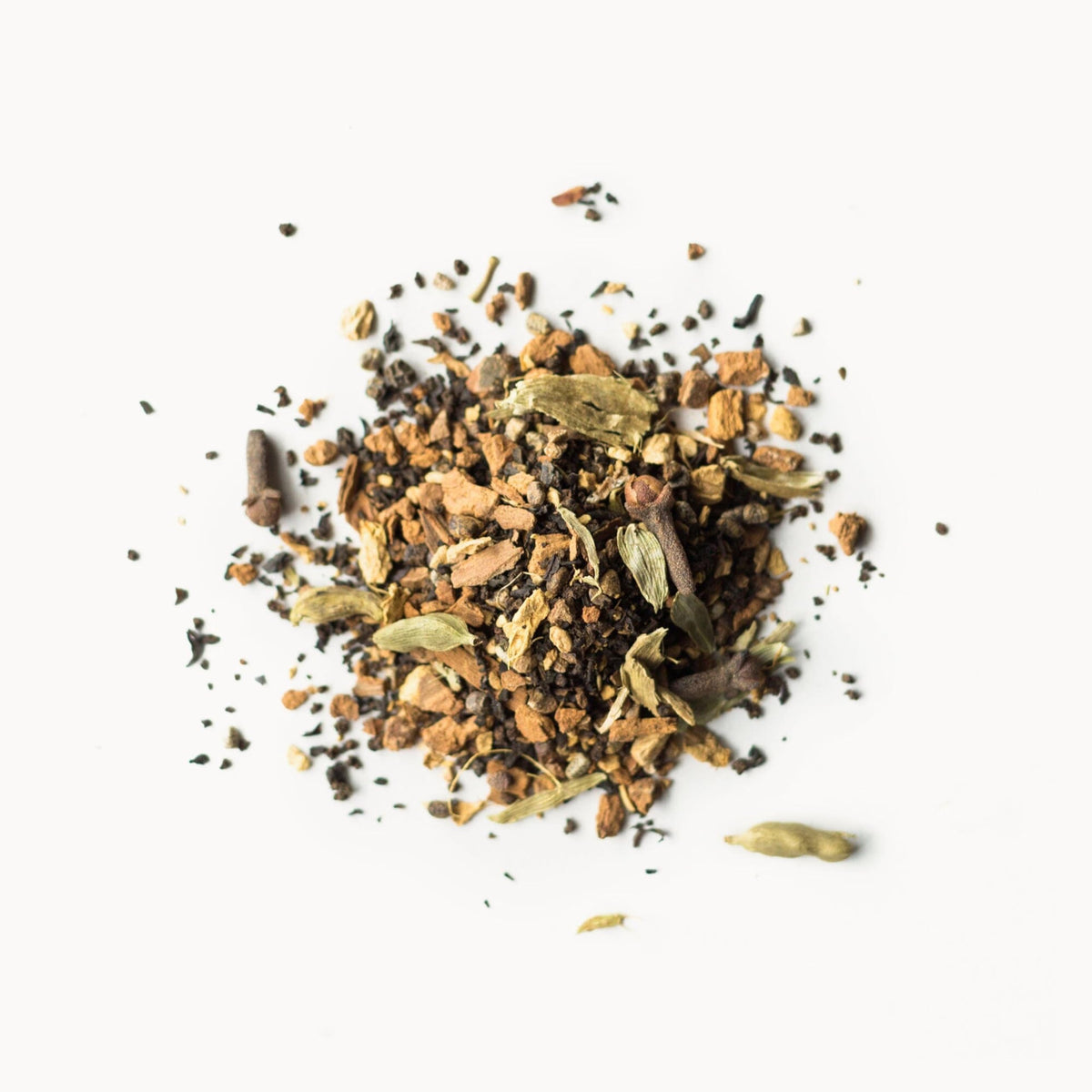 Rishi Tea Masala Chai spice closeup showing vibrant ginger and cardamom aromas.