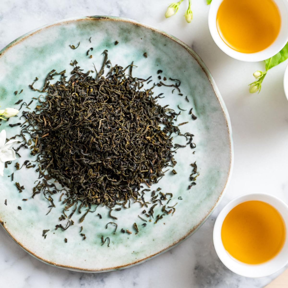 Rishi Jasmine Green Tea packaging in a 4oz tin supports sustainable sourcing.