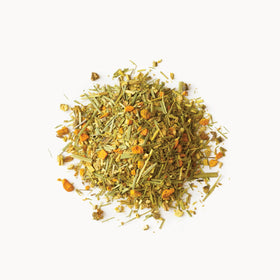Rishi Tea turmeric-ginger iced tea in a tall glass.