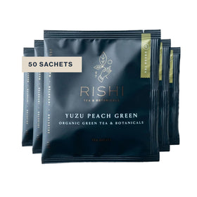 Rishi Tea Yuzu Peach Green Tea packaging highlighting organic ingredients and sustainability.