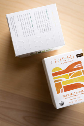 Rishi Turmeric Ginger Tea box side view highlighting organic ingredients.