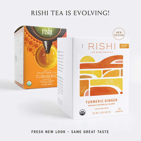 Rishi Turmeric Ginger Tea sachets close-up with aromatic spices and citrus.
