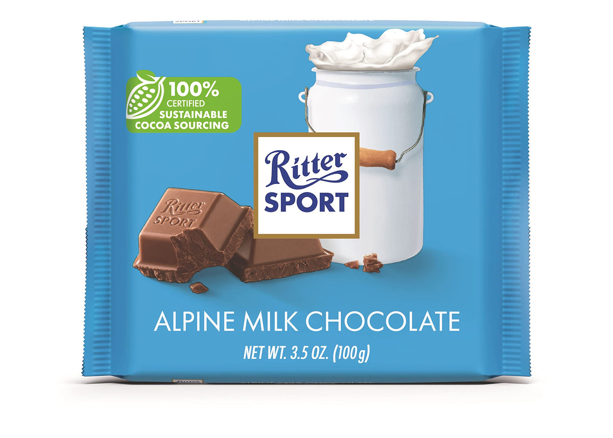 Ritter Sport Alpine Milk Chocolate bar front pack on shelf, showcasing a 12-bar set and sustainable sourcing.