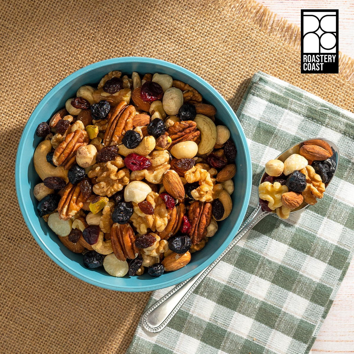 Roastery Coast almonds and macadamias closeup with crunchy textures for snacking.