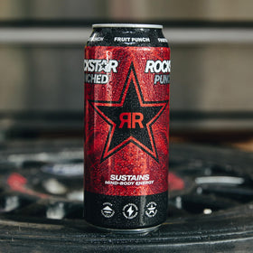 Rockstar Punched Hardcore Apple 16oz can in hand illustrates portable pick-me-up anytime