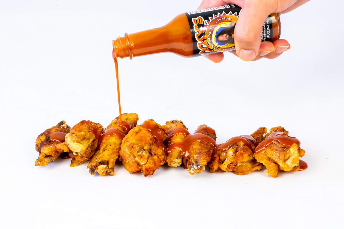 Rocky's Bacon Hot Sauce on mac and cheese enhances creamy dishes.