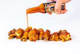 Rocky's Bacon Hot Sauce on mac and cheese enhances creamy dishes.