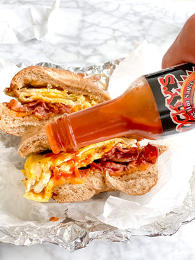 Rocky's Bacon Hot Sauce on wings delivers bold, bacon-inspired heat.