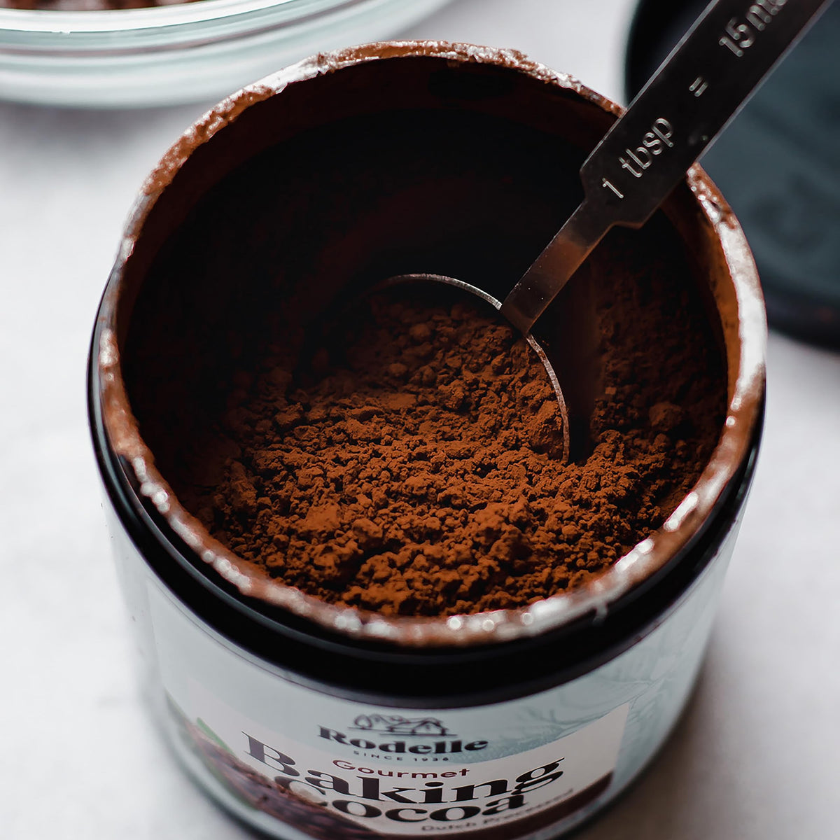 Rodelle cocoa powder closeup showing deep color and smooth texture